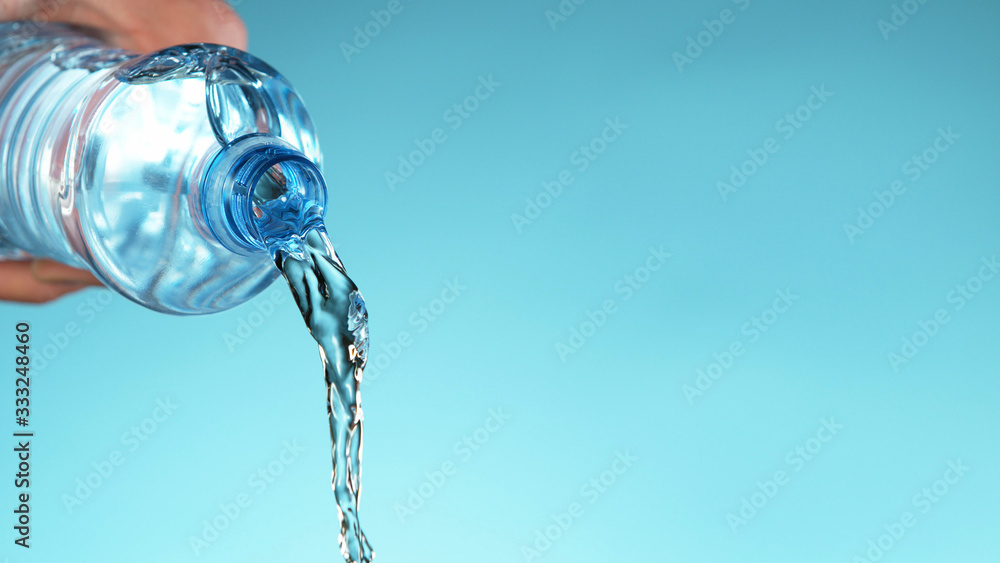 Freeze motion of pouring water from plastic bottle