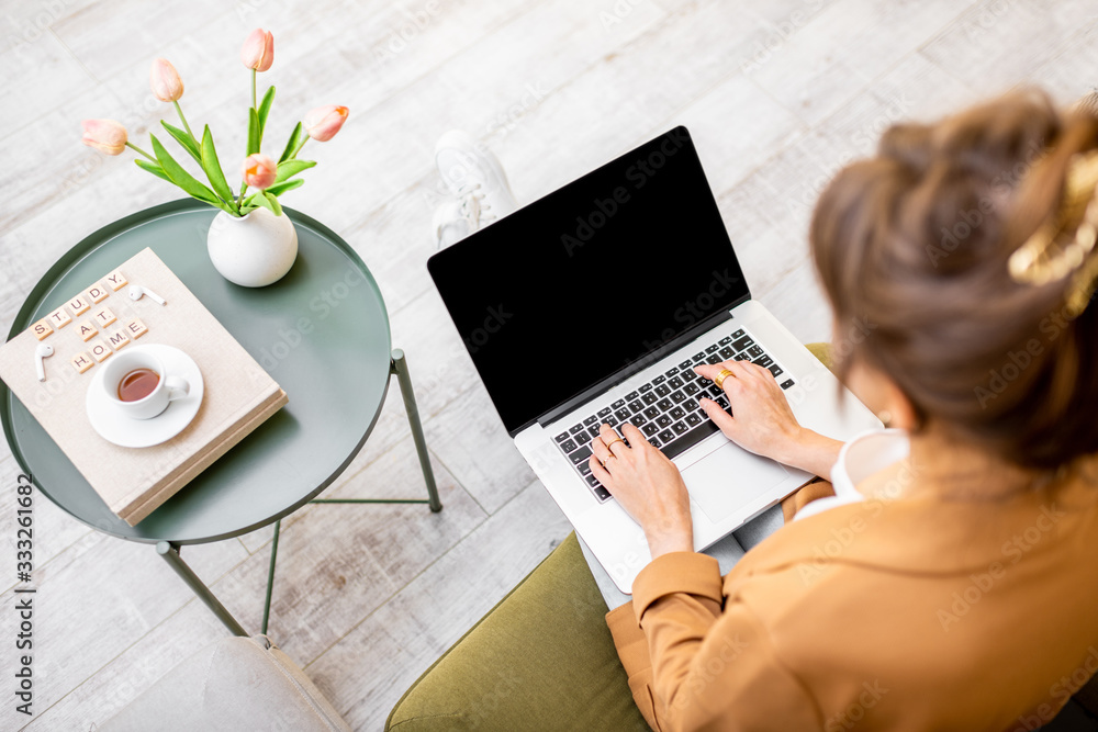 Woman working on computer at home, laptop with black screen to copy paste, view from above. Concept 