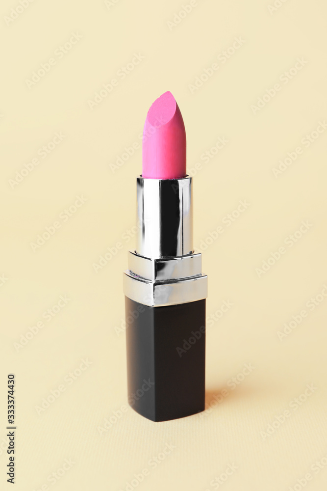 Beautiful lipstick on color background