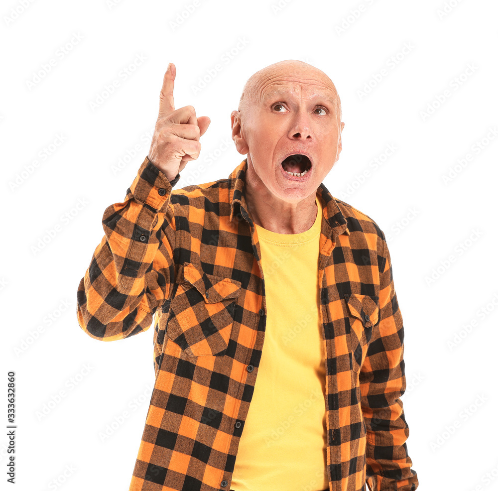 Portrait of elderly man with raised index finger on white background