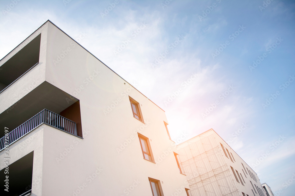 Modern apartment building flat estate concept. Outdoor residential facility at sunset and sunrise.