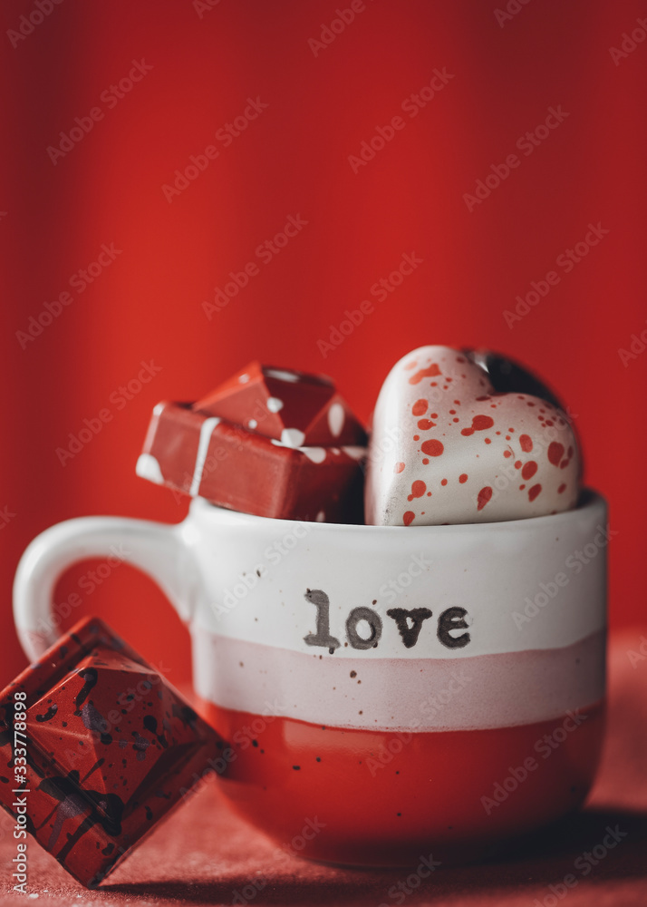 cup of chocolates with hearts