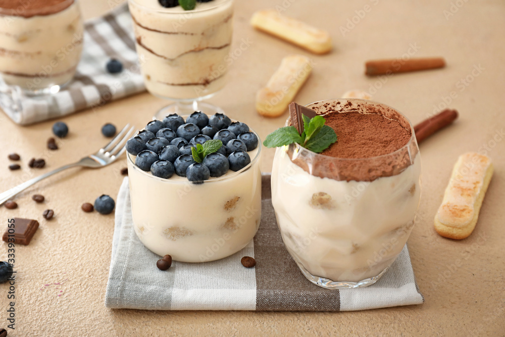 Tasty tiramisu on color background