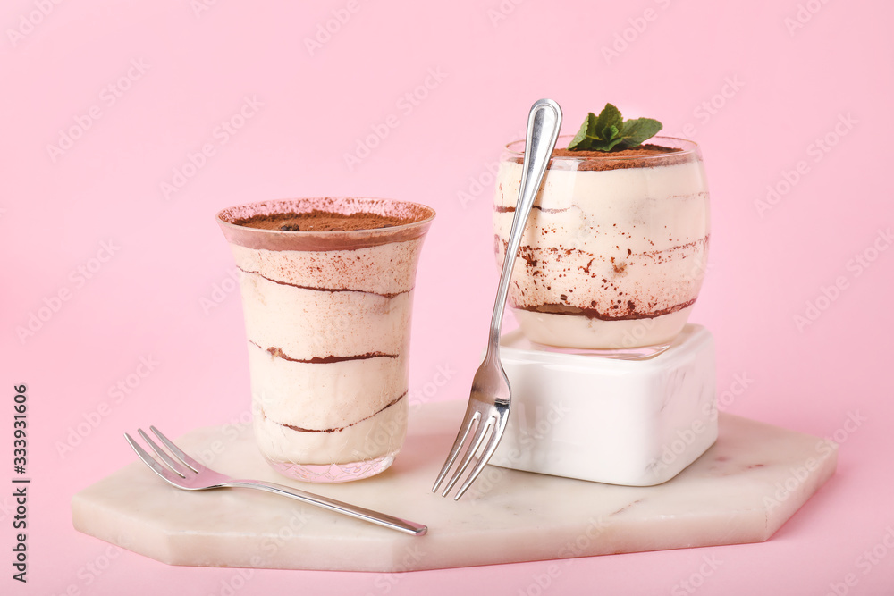 Tasty tiramisu on color background