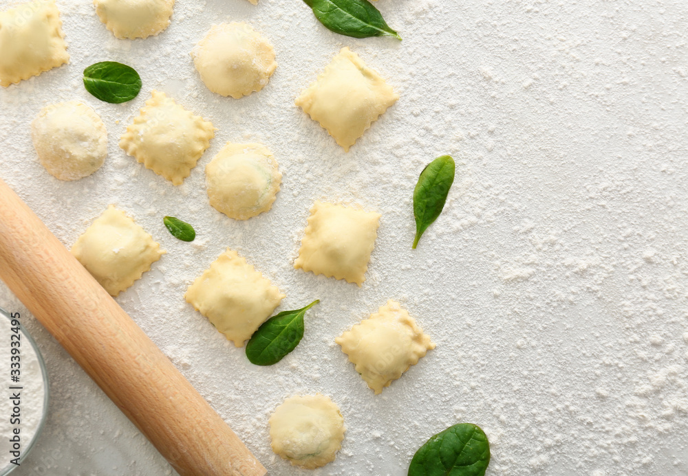 Uncooked ravioli on white background