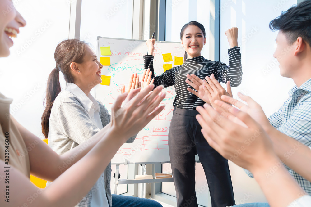 smart asian business female leader in a casual meeting with her teamwork colleagues at the modern de