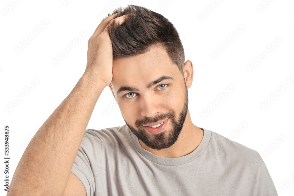 Handsome man with healthy hair on white background