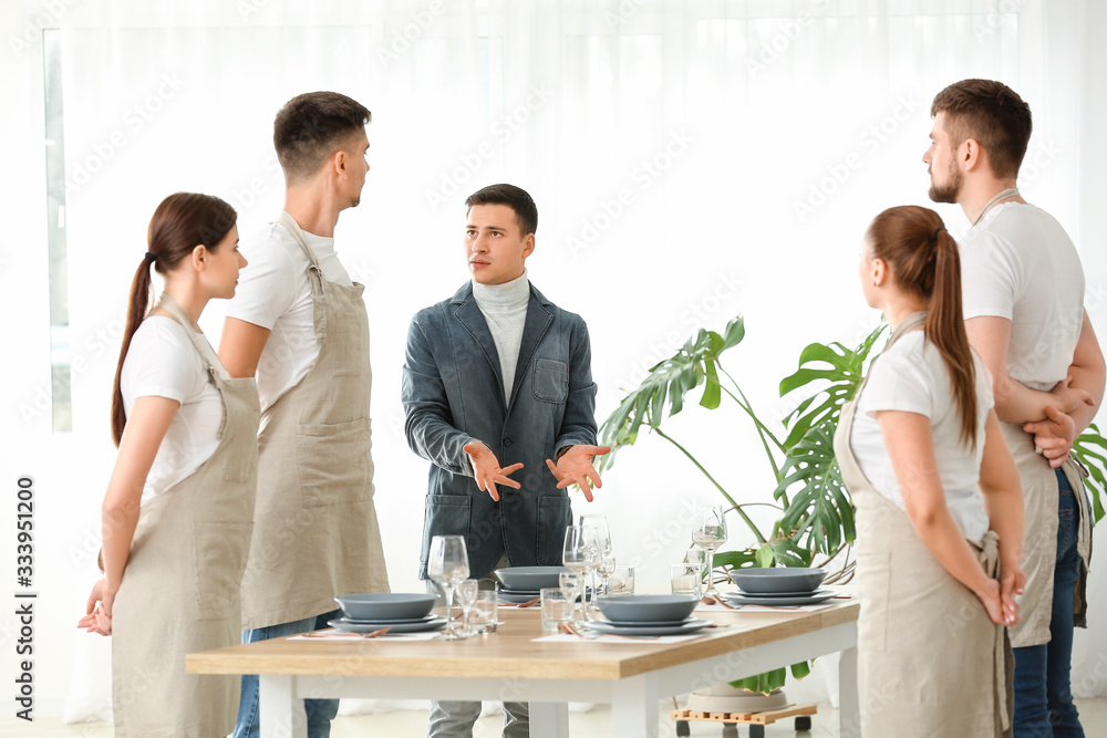 Young people attending professional waiter courses