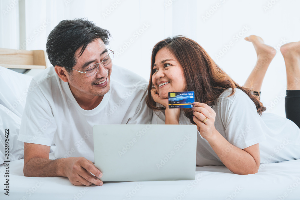 Happy Asian senior couple having good time at home. Old people retirement and healthy citizens elder