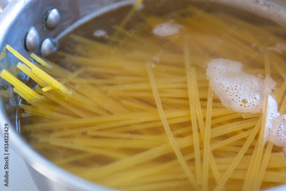 Spaghetti pasta boiling in a pot