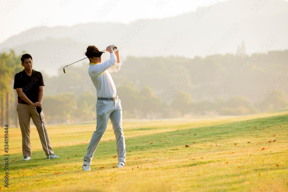 Asian man golfer playing golf with friend  at golf course