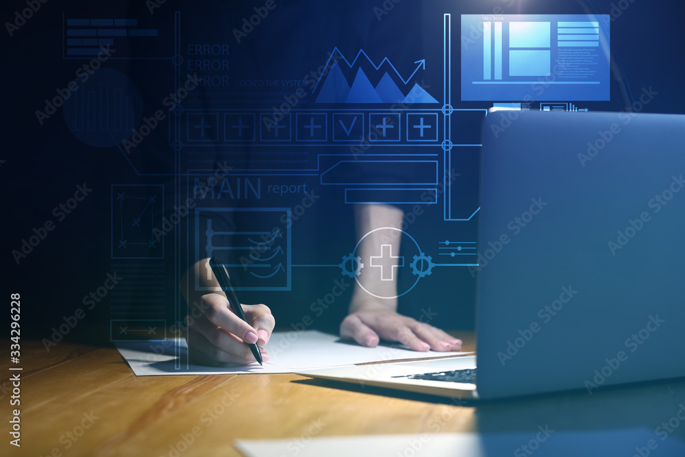 Businesswoman working in office at night