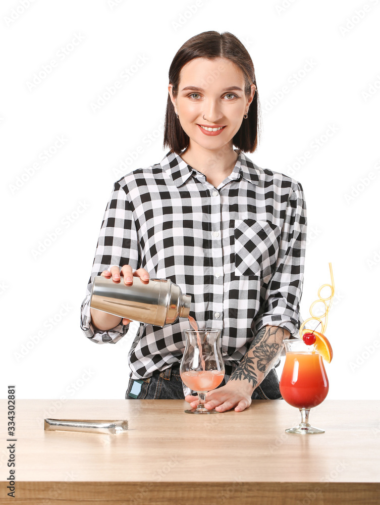 Beautiful female bartender at table against white background