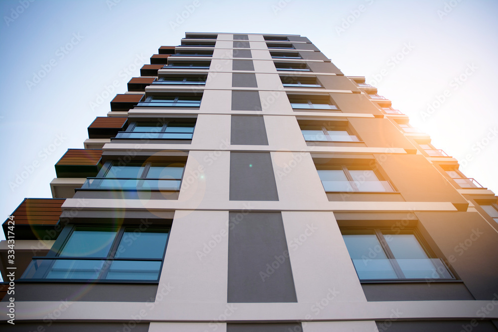 Apartment residential house and home facade architecture and outdoor facilities. Blue sky on the bac