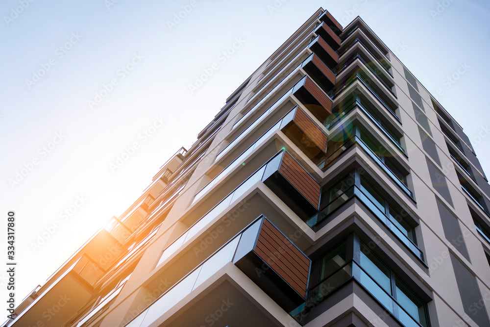 Apartment residential house and home facade architecture and outdoor facilities. Blue sky on the bac