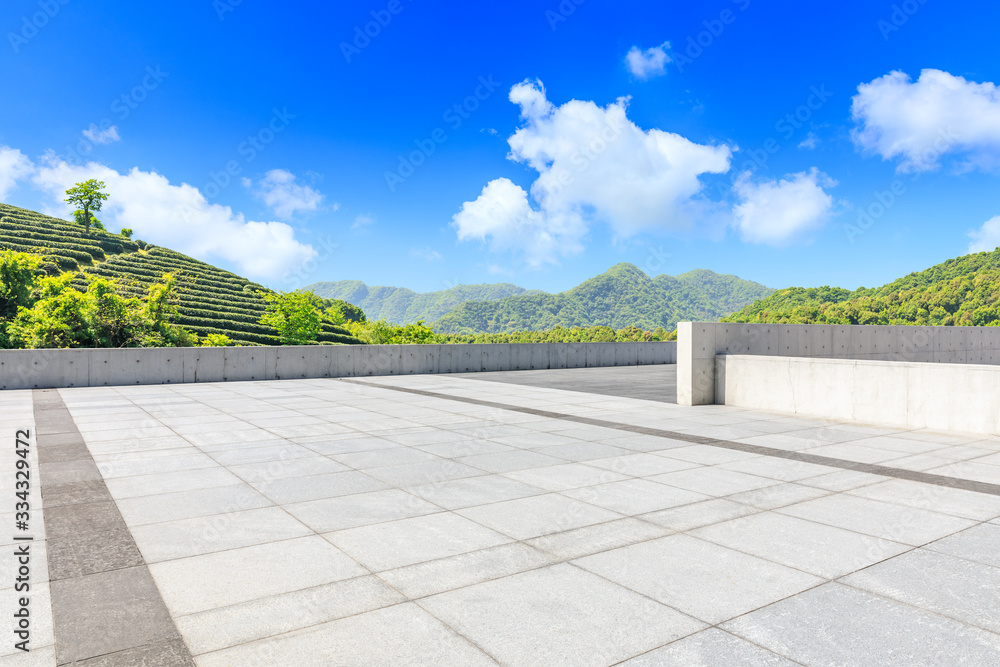 Empty square floor and green tea plantation nature landscape.