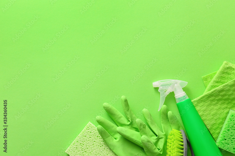 Set of cleaning supplies on color background