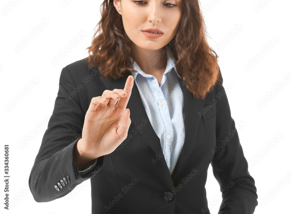 Businesswoman using virtual screen on white background