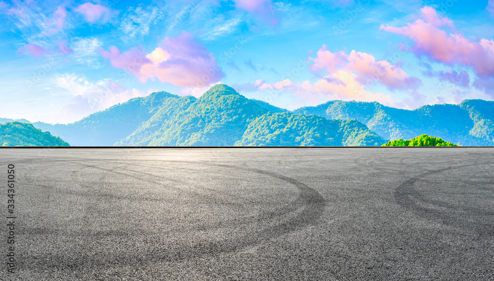 Race track road and green tea plantation nature landscape at sunset.