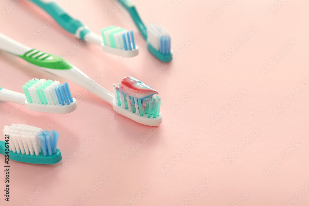 Tooth brushes with paste on color background