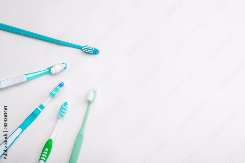 Tooth brushes with paste on white background