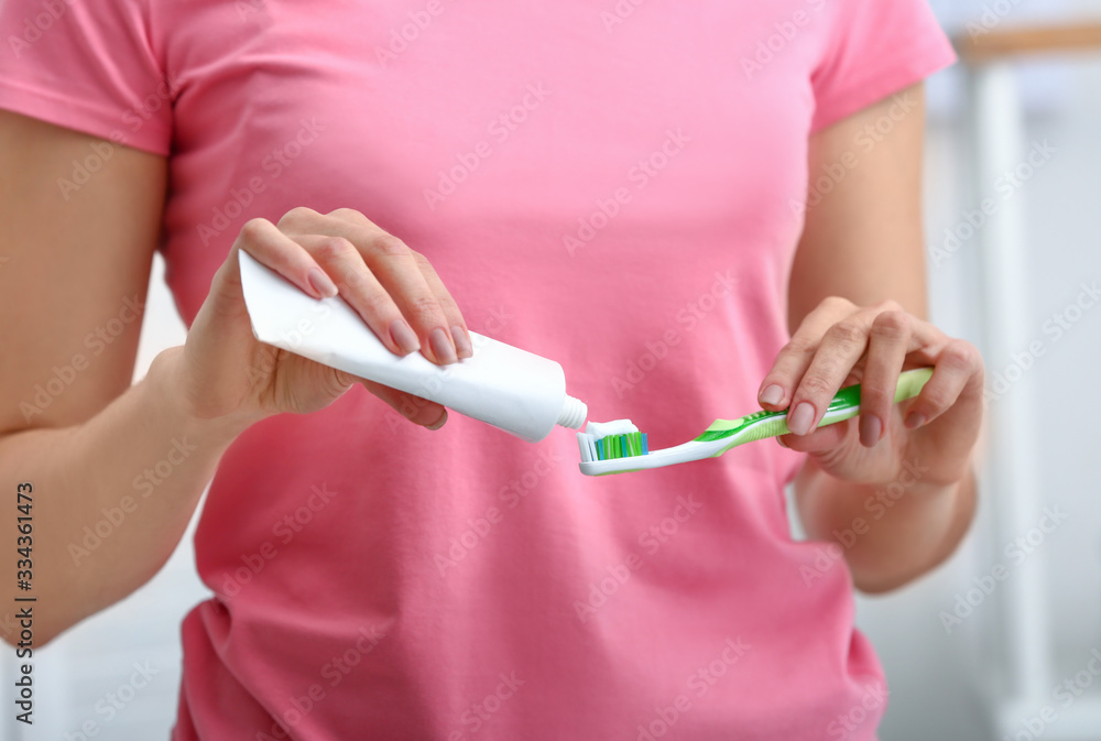 Woman with tooth brush and paste, closeup