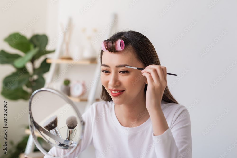 Attractive talented female blogger reviews beauty product for video blog, gives advice to girls and 