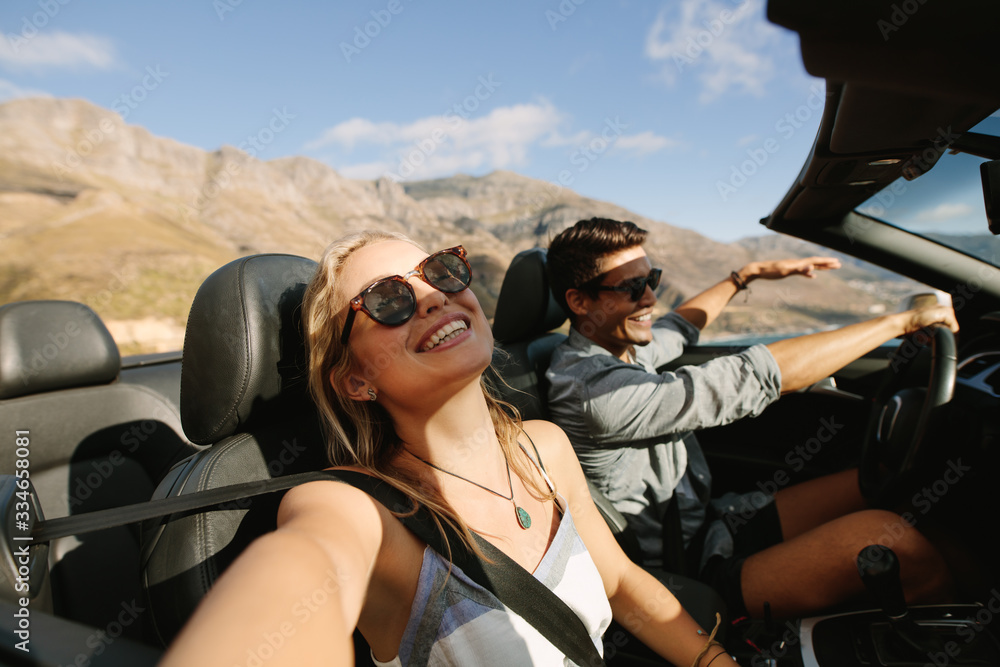 Beautiful couple enjoying on a road trip