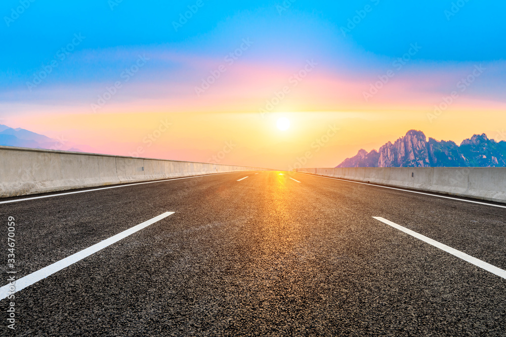 Empty road and mountain with sky sunset clouds landscape.