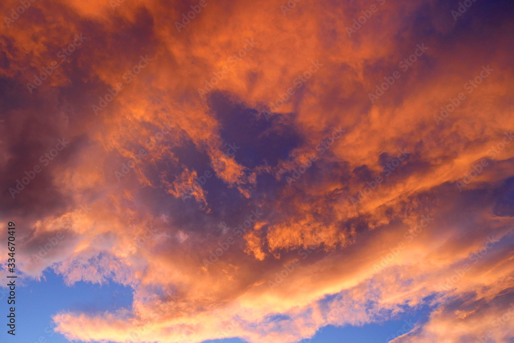 Golden sunshine and orange clouds at sunset