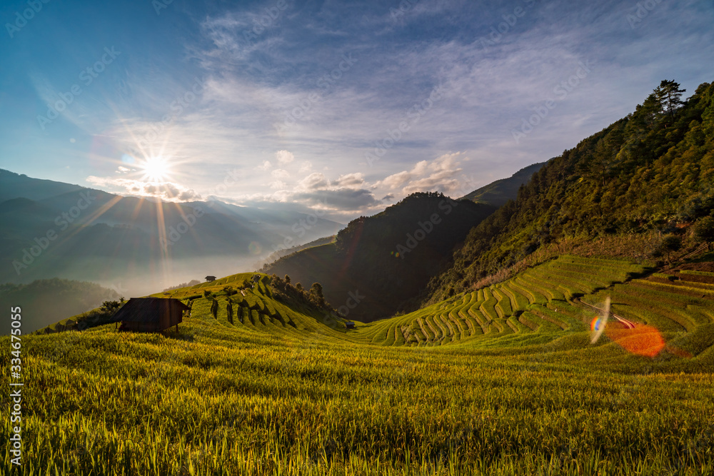 Sunset over Terraced rice field with lens flares, Mu Cang Chai, Yen Bai, Vietnam