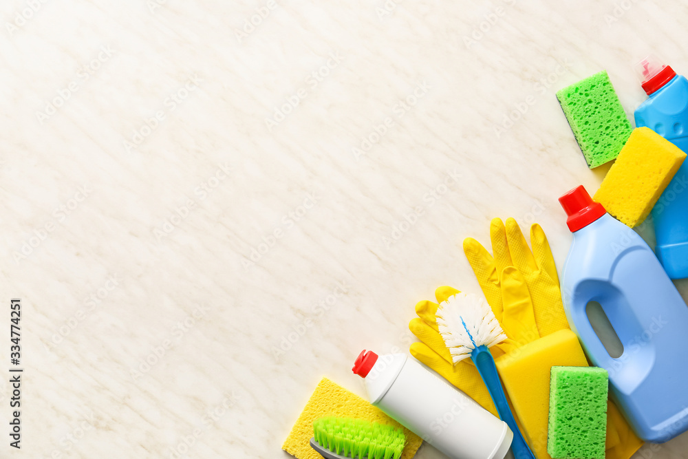 Set of cleaning supplies on light background