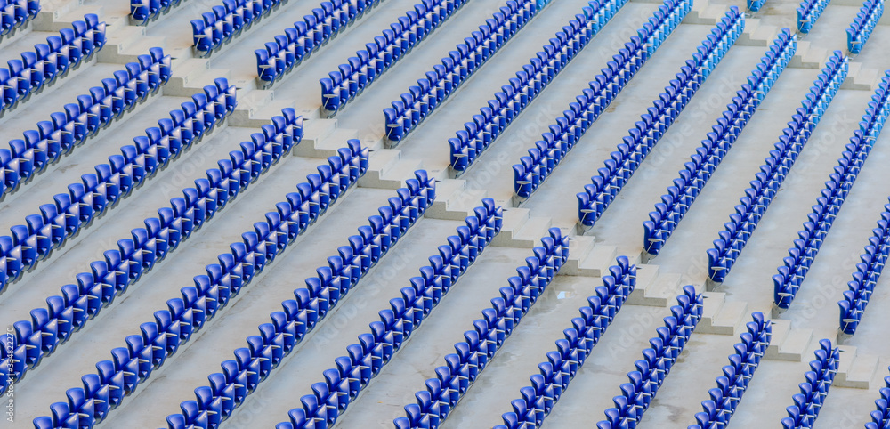 Empty dark-blue seats at the stadium before the match