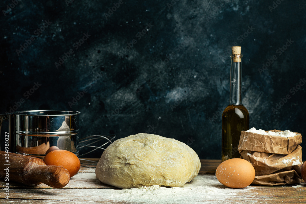 Pizza dough cooking in the home kitchen. Homemade dough for bread, pizza, pastries and rolls. Dough 