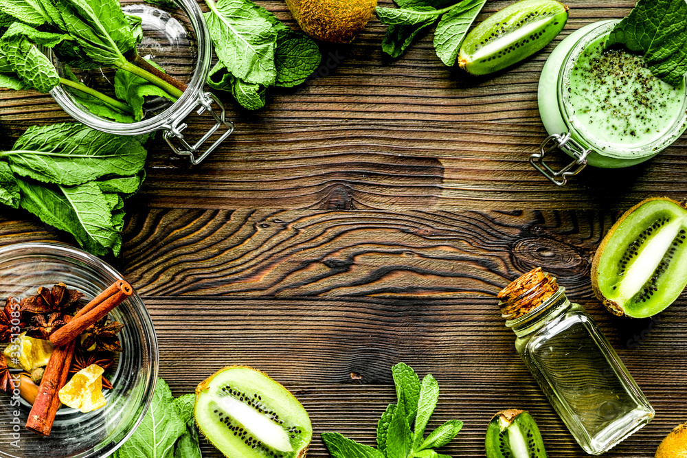 body scrub with kiwi in cosmetics concept wooden background top view mockup