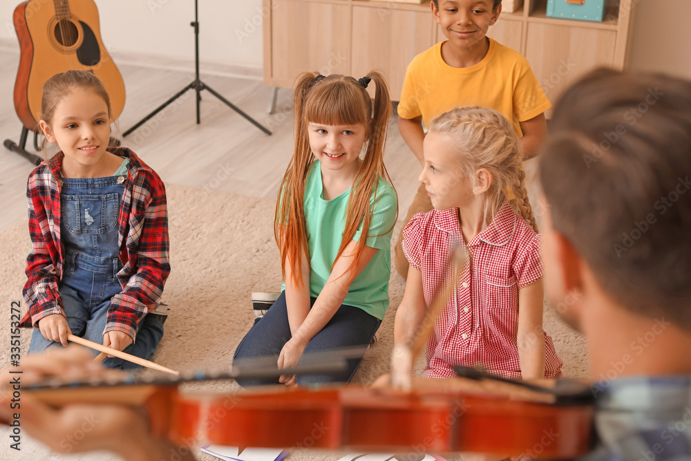 Cute little children at music school