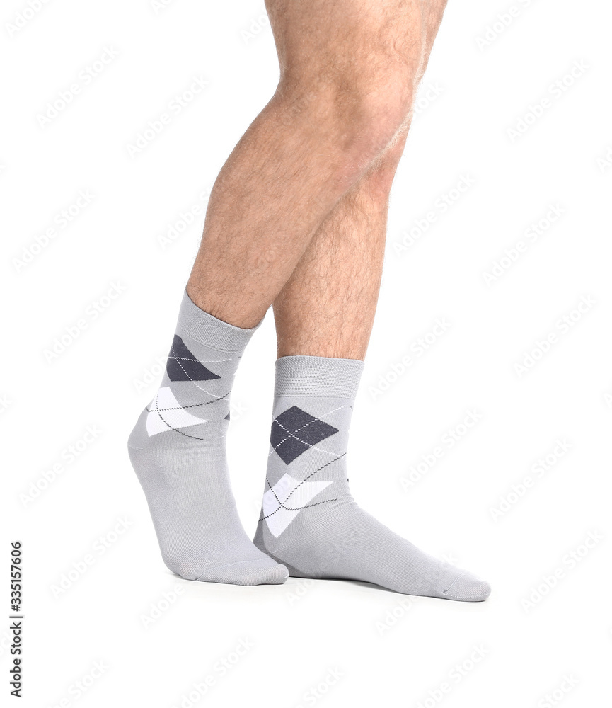 Male legs in socks on white background