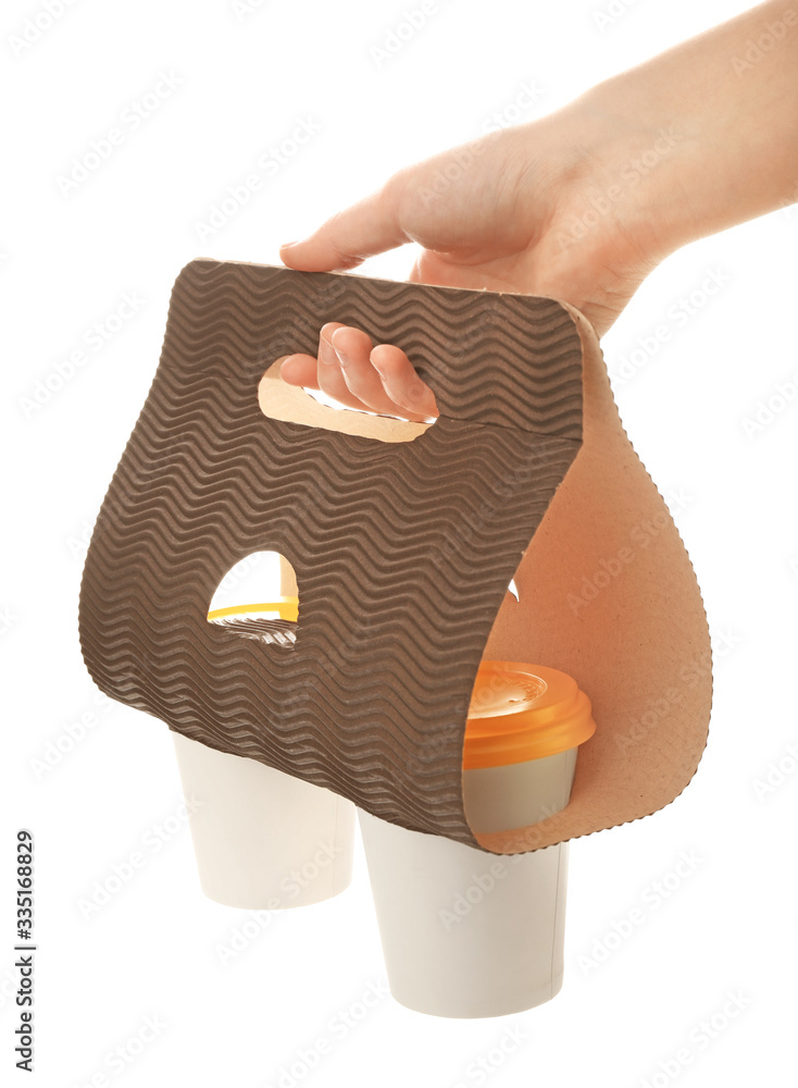 Female hand with takeaway coffee cups on white background