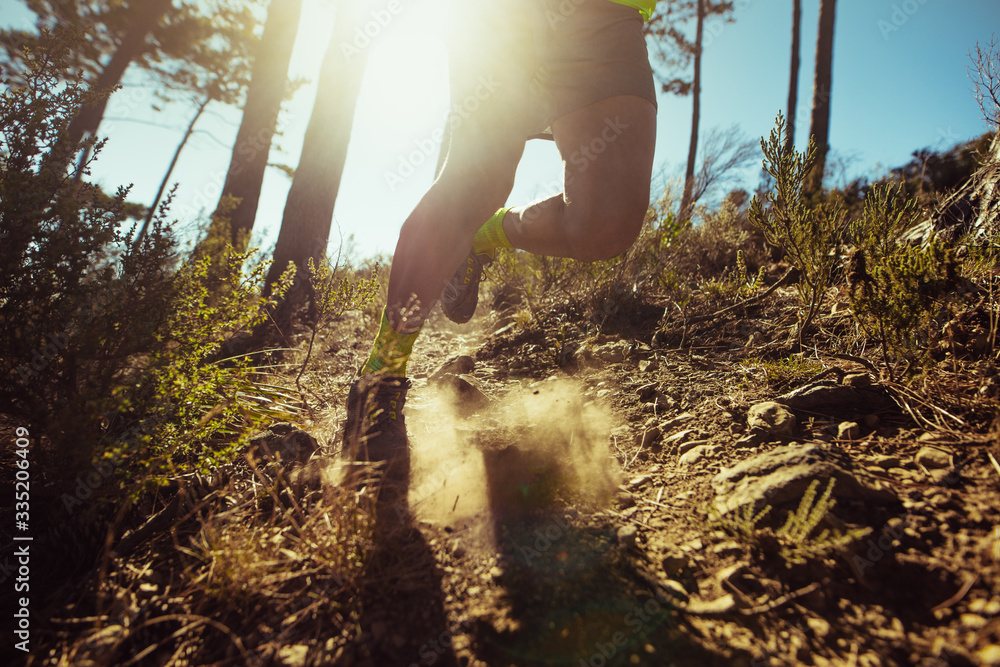 Man running down a rocky mountain slope