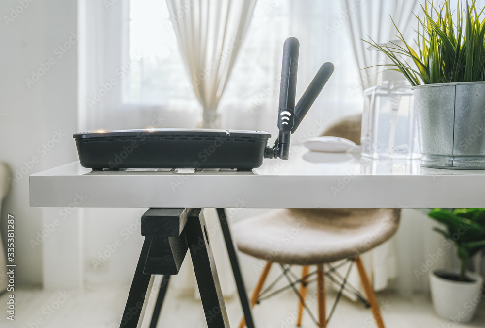 closeup of a wireless router on living room at home ofiice, equipment  for working from home, while 