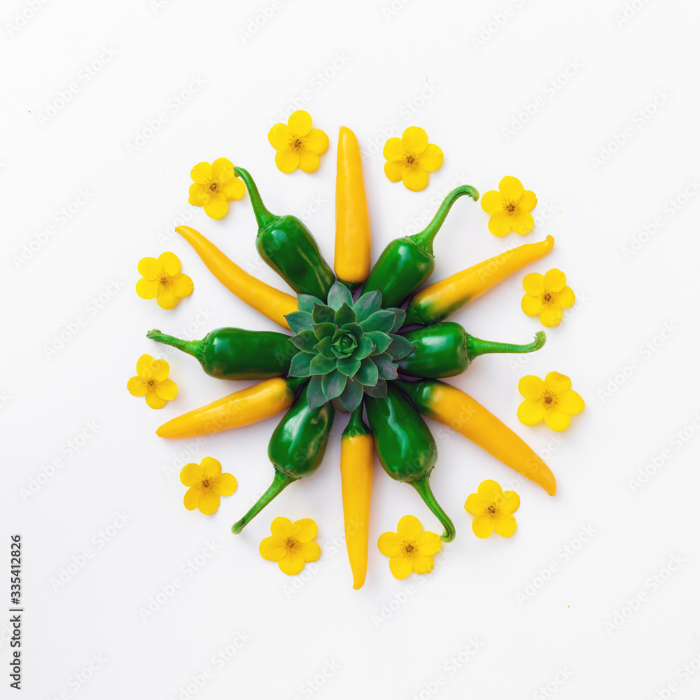 Yellow and green hot peppers with flowers compositions. Food photography