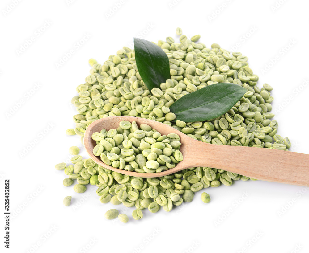 Spoon with green coffee beans on white background