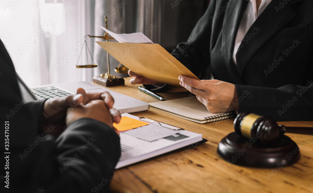 business people and lawyers discussing contract papers sitting at the table. Concepts of law, advice