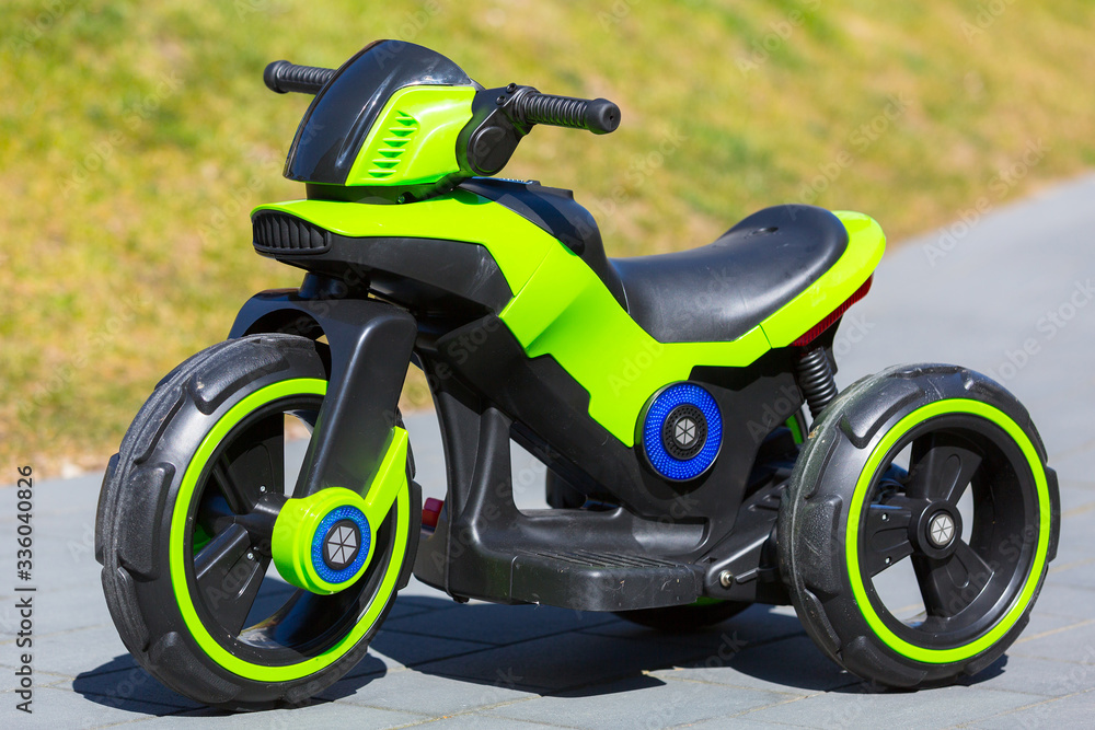 An electric motorcycle for kids in the garden