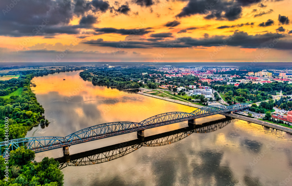 Jozef Pilsudski Bridge across the Vistula River at sunset in Torun, Poland