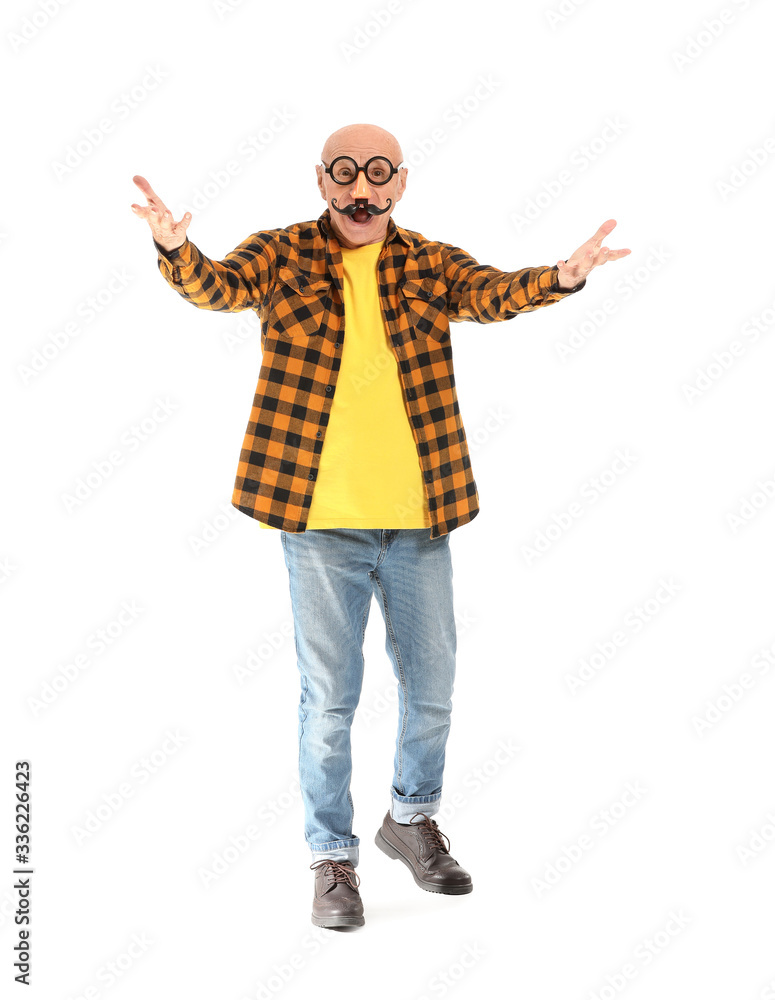 Portrait of emotional elderly man with party decor on white background