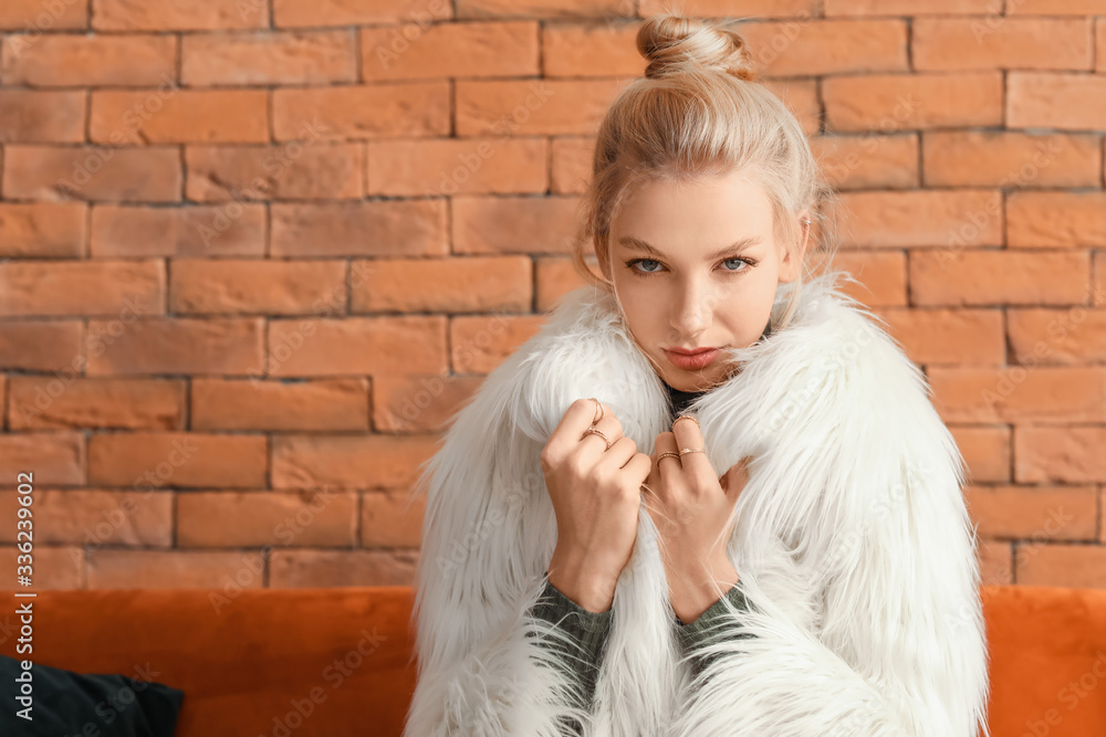 Young woman in stylish clothes indoors