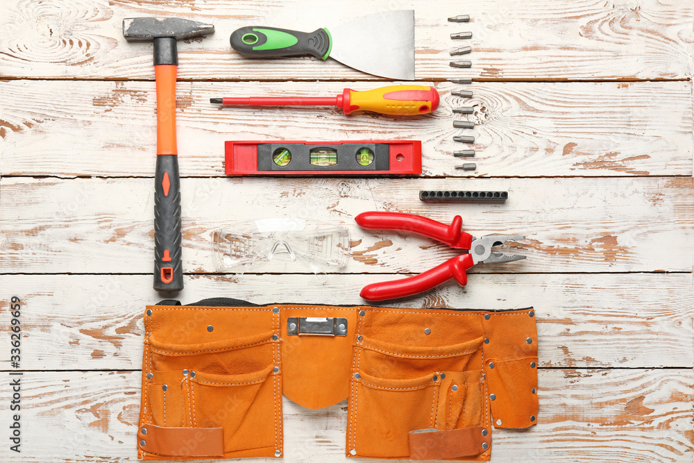 Builders tools on wooden background