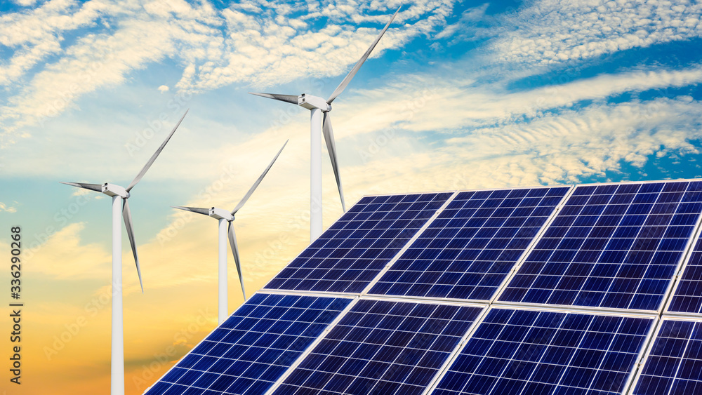 Solar panels with wind turbines in the setting sun,green energy.