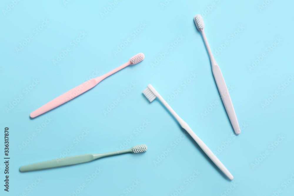 Tooth brushes on color background